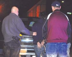 Prostitution crackdown: A suspect is arrested on Auckland Street during a Boston Police decoy operation on Friday, Oct. 12.